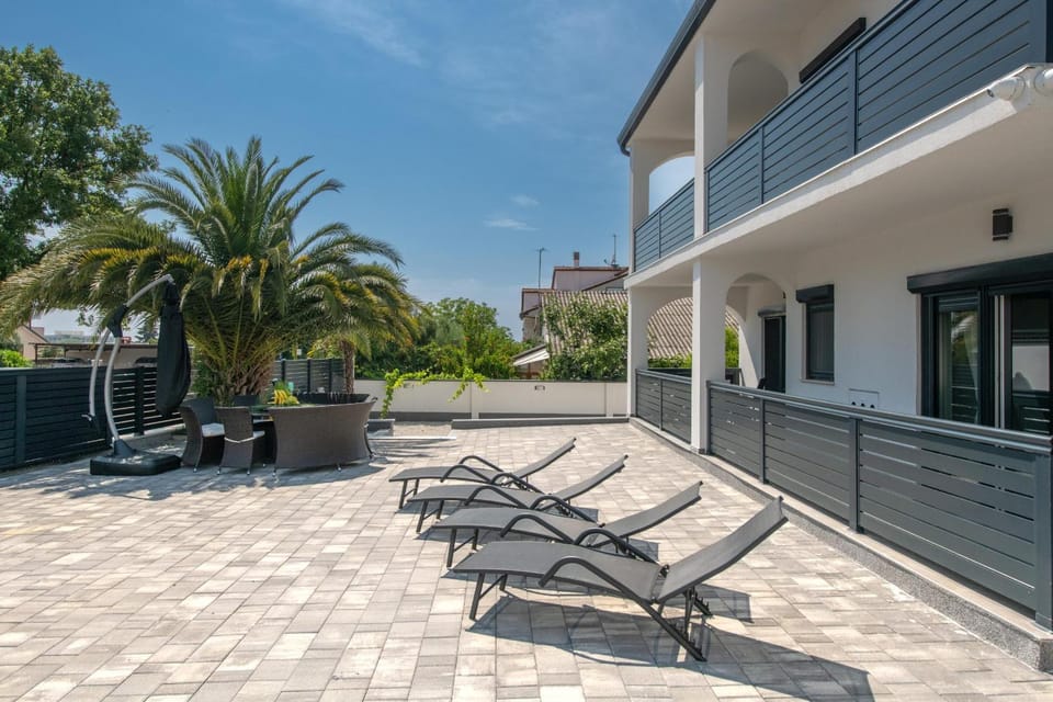 Property building, Patio, Day, View (from property/room), Balcony/Terrace, sunbed