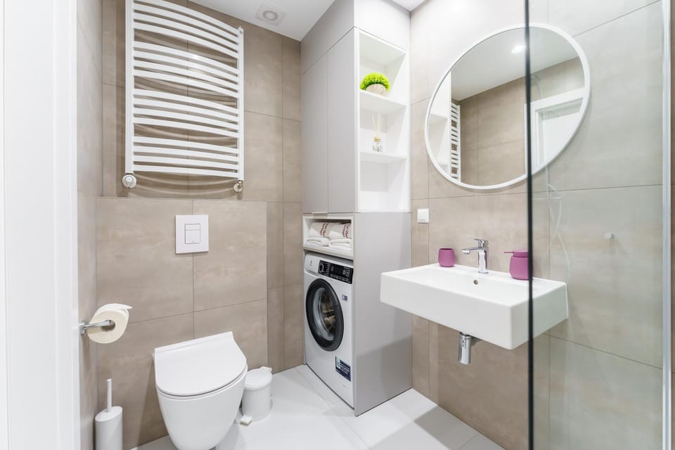 Shower, Toilet, Bathroom, bidet, towels, washing machine, dryer
