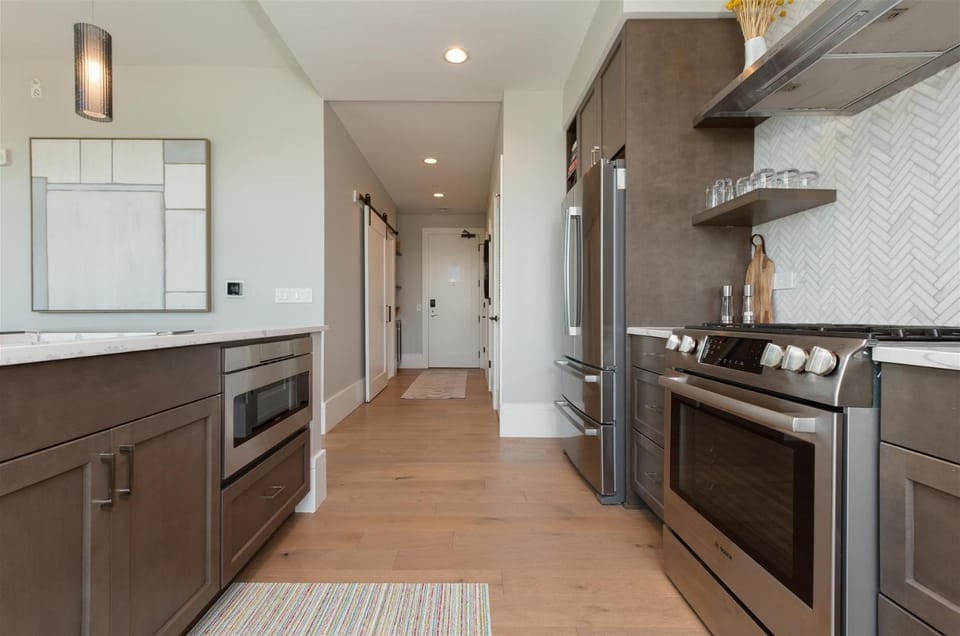 Kitchen or kitchenette, dishwasher, oven, stove