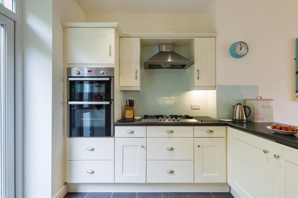 Kitchen or kitchenette, dishwasher, oven, stove