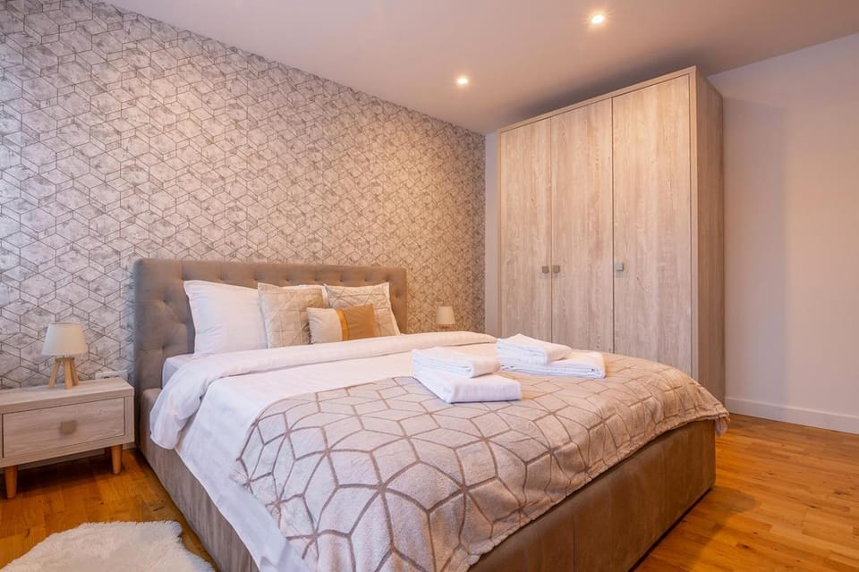 Bed, towels, wardrobe