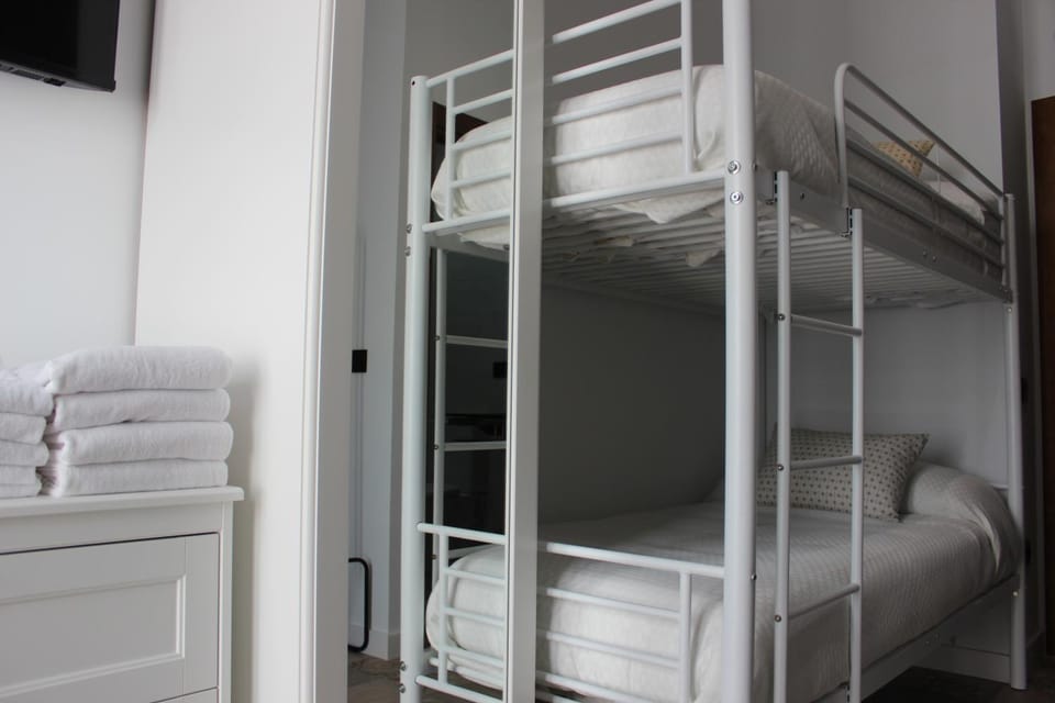 Bed, Bedroom, bunk bed, towels, wardrobe