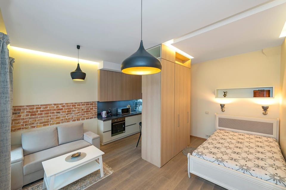 Bed, TV and multimedia, Kitchen or kitchenette, Living room, Photo of the whole room, Seating area, Bedroom