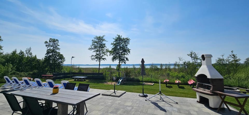 Villa Koprowo - mit direktem Seezugang, Sauna & Whirlpool Villa in West Pomeranian Voivodeship, Poland