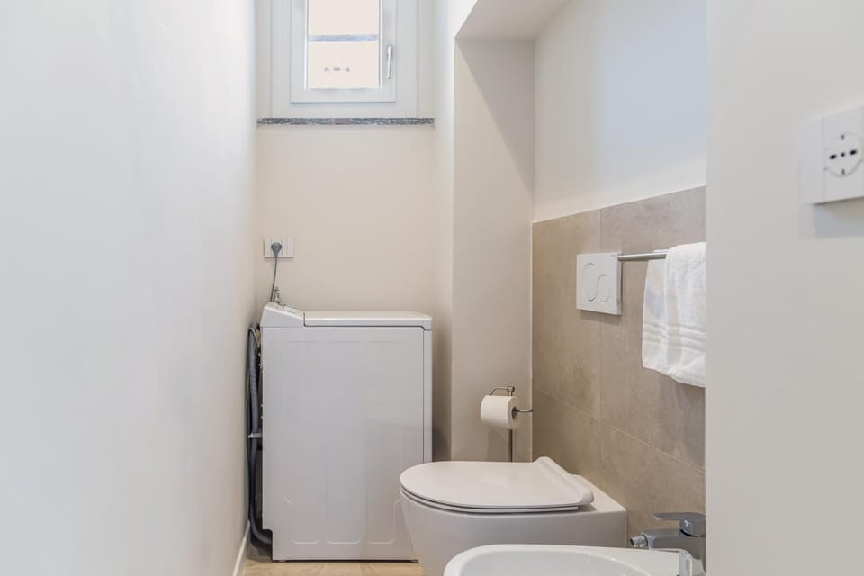 Shower, Toilet, Bathroom, bidet, towels, washing machine