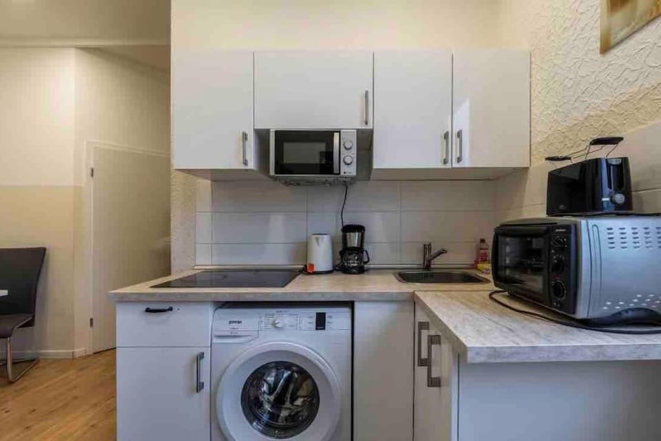 Kitchen or kitchenette, washing machine