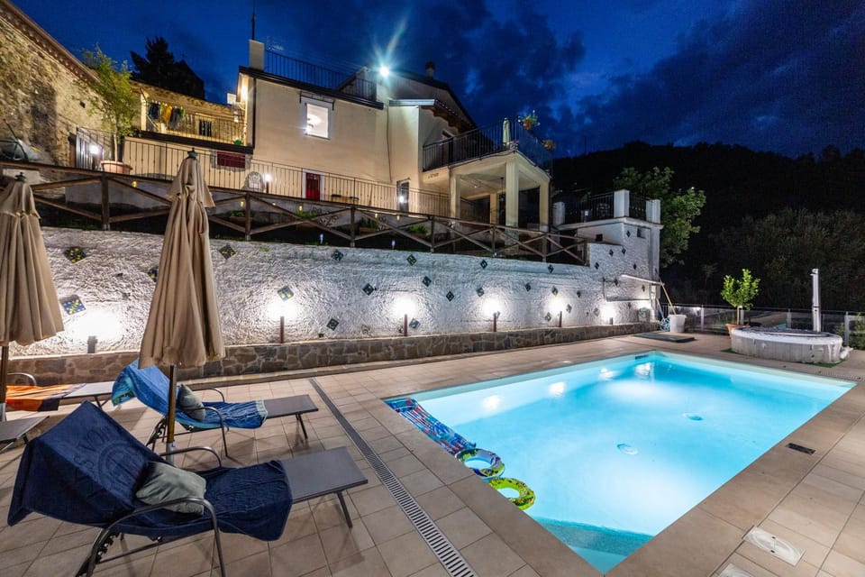 Property building, Patio, Night, Natural landscape, Pool view, Swimming pool, sunbed
