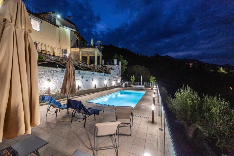 Property building, Patio, Night, Natural landscape, Hot Tub, View (from property/room), Balcony/Terrace, Pool view, Swimming pool, sunbed