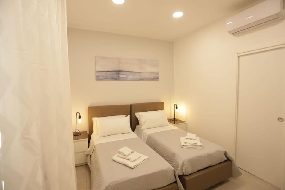 Bed, Photo of the whole room, Bedroom, towels, air conditioner