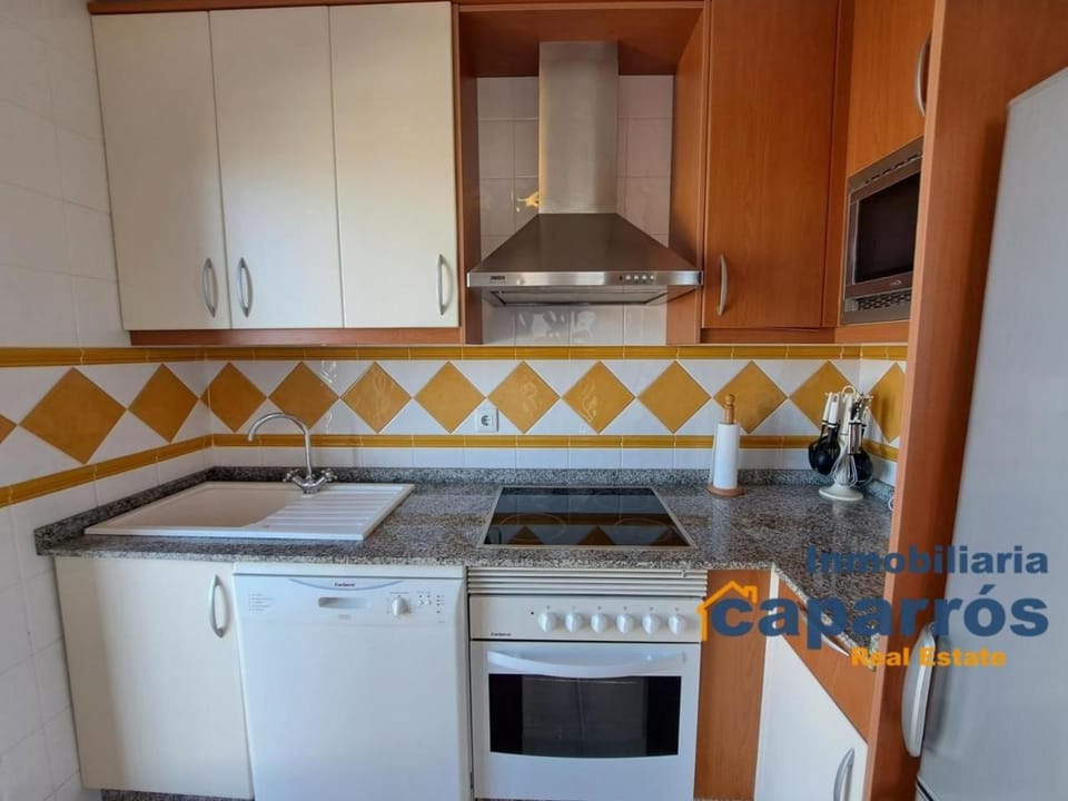 Kitchen or kitchenette, dishwasher, stove