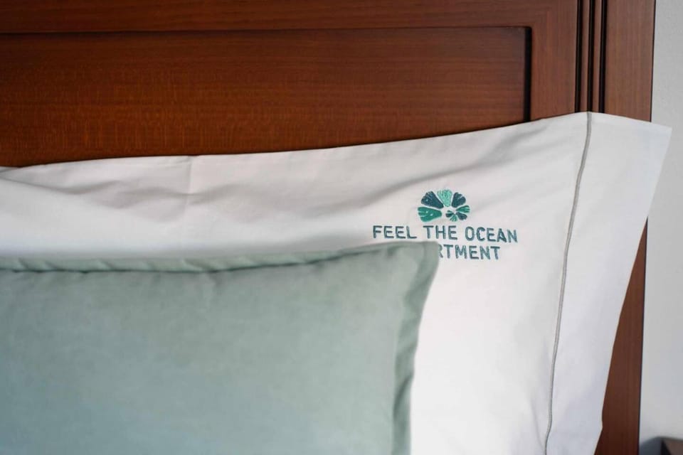 Bed, Property logo or sign, Decorative detail, Bedroom