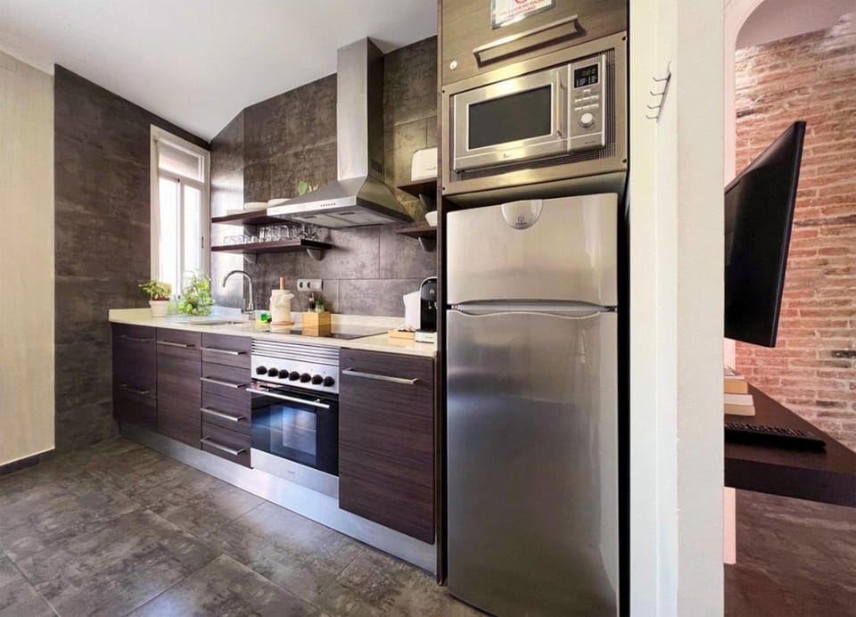 Kitchen or kitchenette, dishwasher, oven, stove, toaster