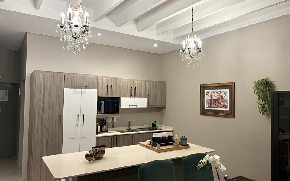 Kitchen or kitchenette, dishwasher, oven, stove