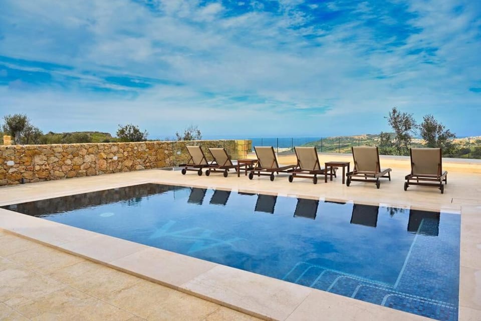 Patio, Day, Natural landscape, Pool view, Swimming pool, sunbed