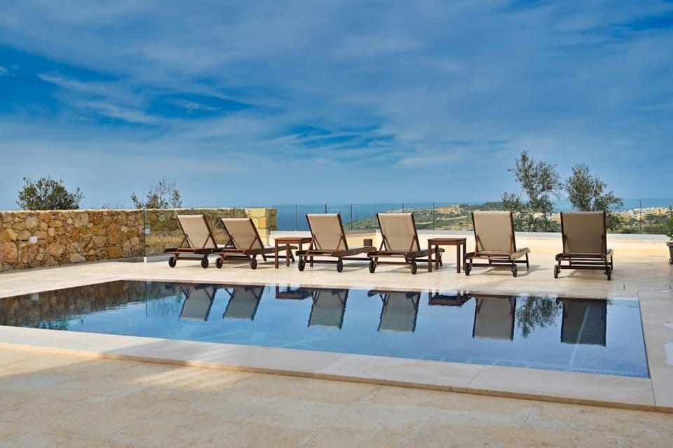 Patio, Day, Natural landscape, Pool view, Swimming pool, sunbed