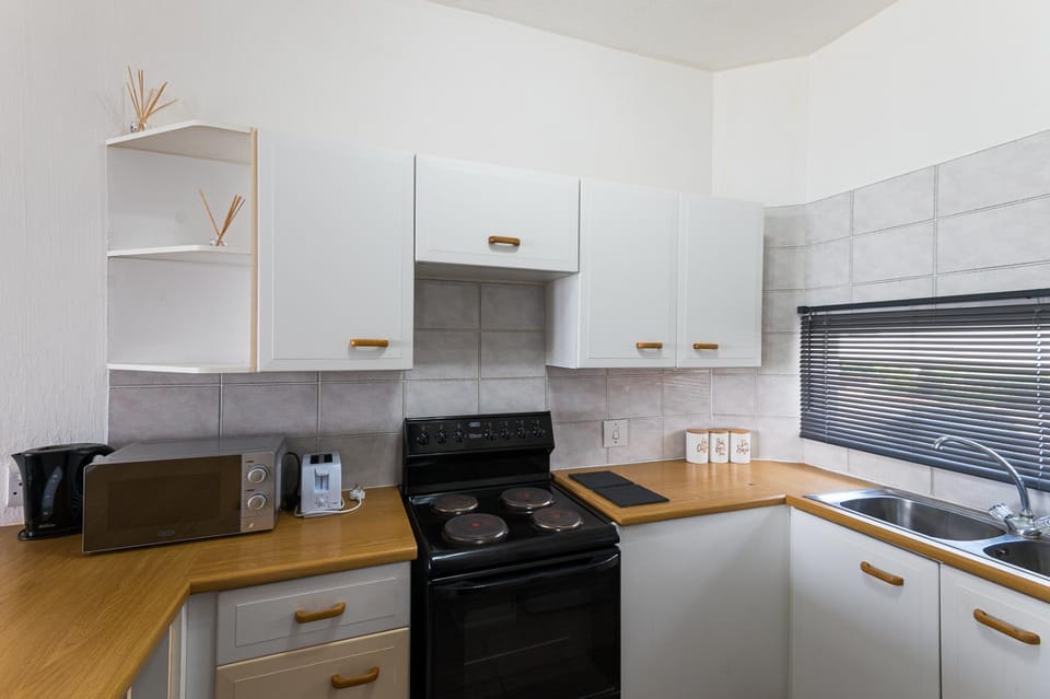 Kitchen or kitchenette, stove, toaster