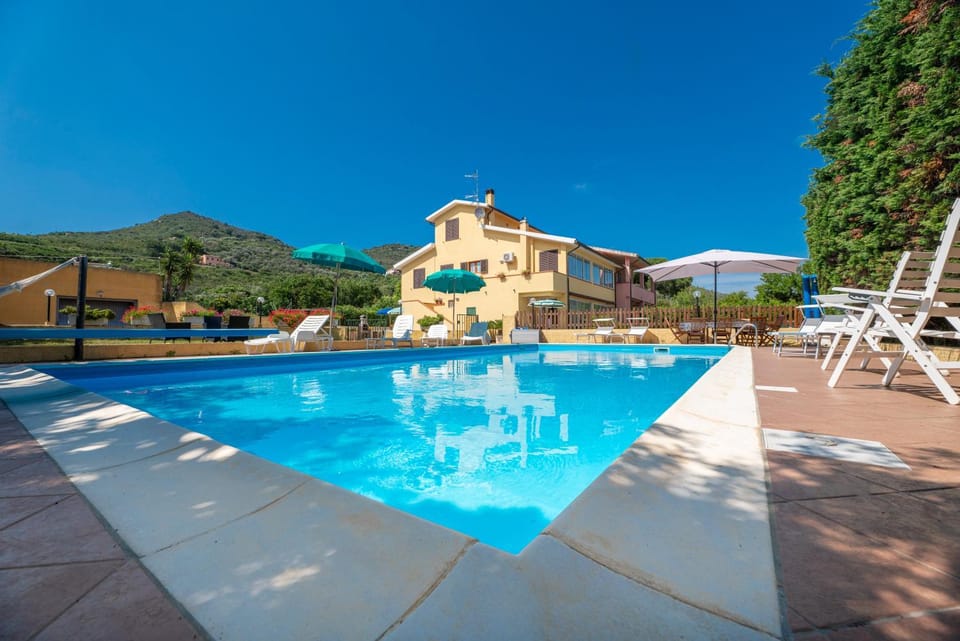 Property building, Natural landscape, Pool view, Swimming pool, sunbed