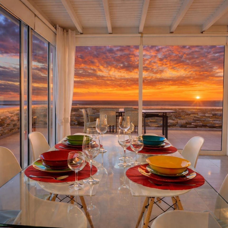 Natural landscape, View (from property/room), Balcony/Terrace, Living room, Food and drinks, Seating area, Dining area, Sea view, Sunset