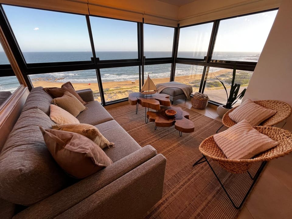 Natural landscape, View (from property/room), Living room, Seating area, Sea view