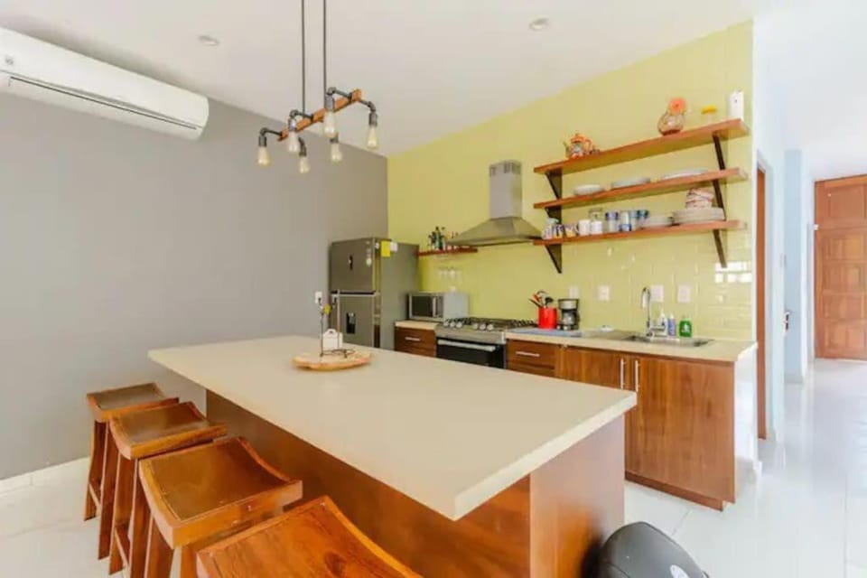 Kitchen or kitchenette, Dining area, fireplace, oven, stove, air conditioner
