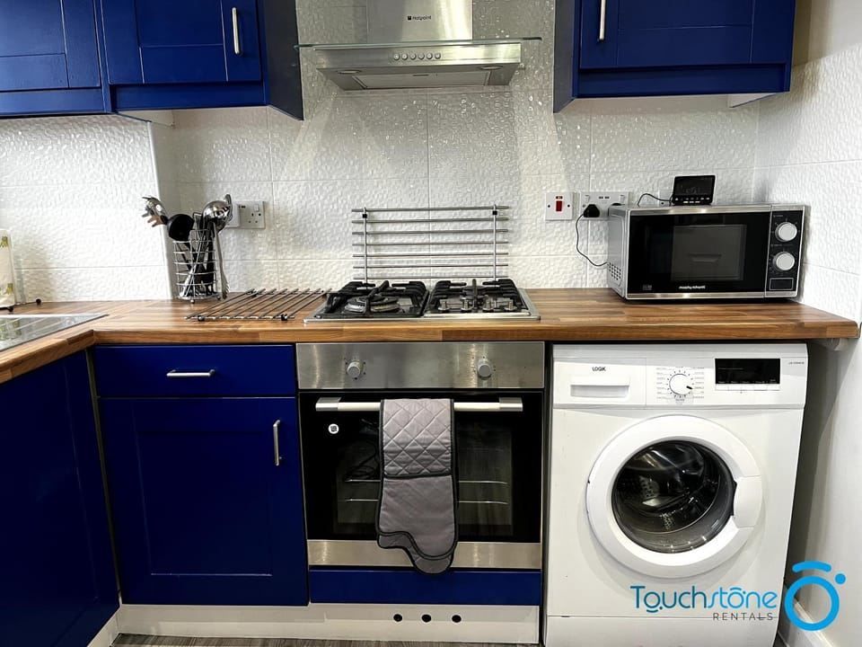 Dining area, minibar, stove, washing machine, kitchen