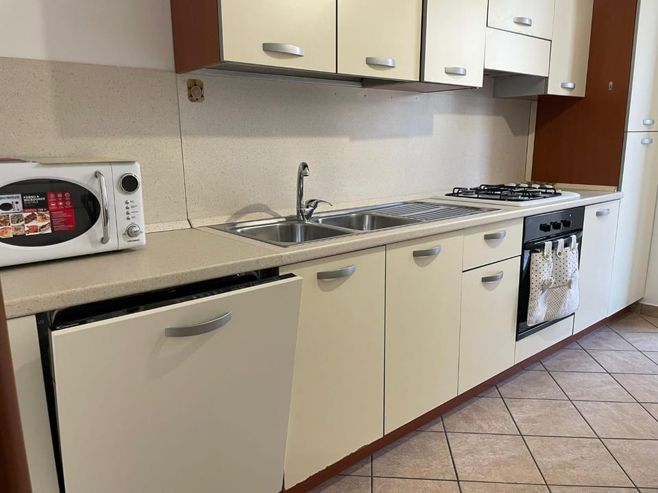 Kitchen or kitchenette, dishwasher, stove, washing machine