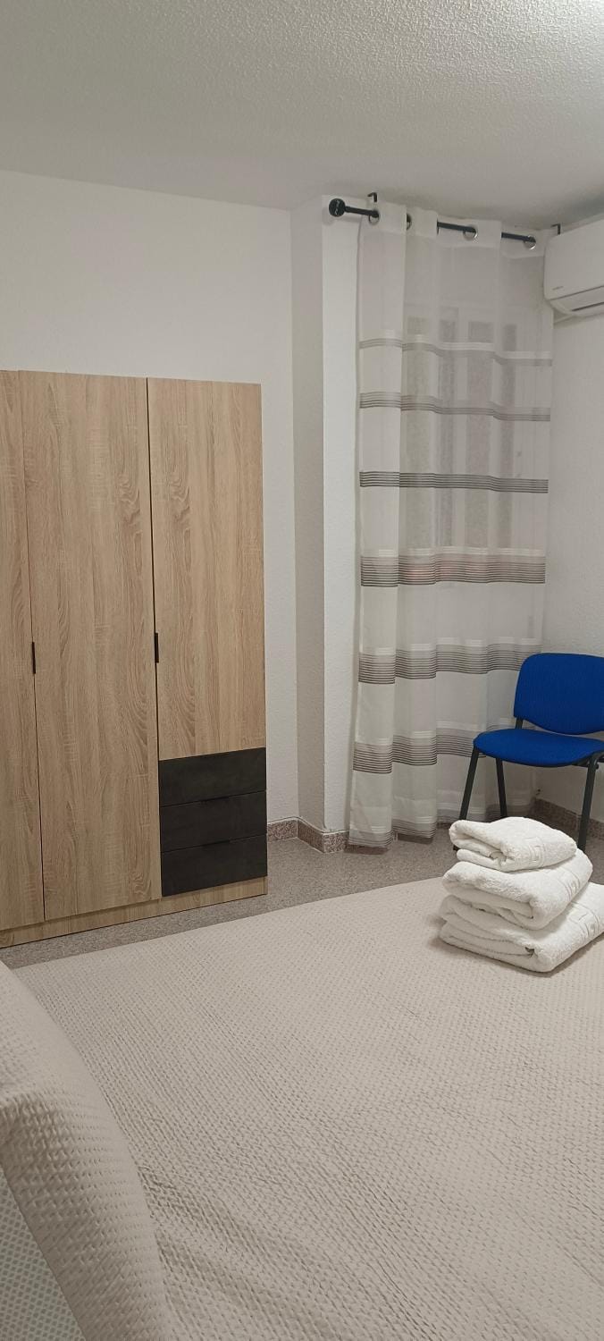 Bed, Living room, Seating area, Bedroom