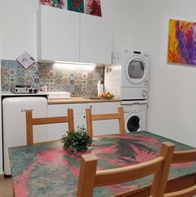 Kitchen or kitchenette, Dining area, stove, washing machine, dryer