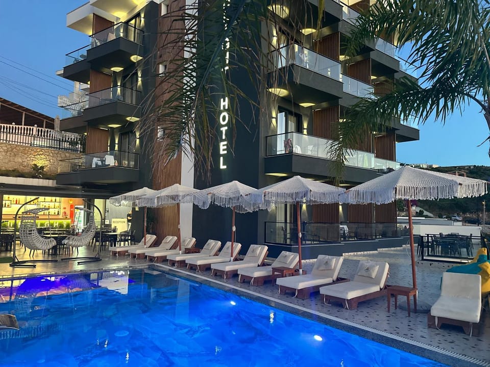 Property building, Patio, Pool view, Swimming pool, sunbed