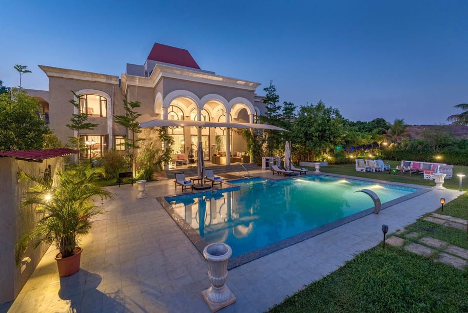 Property building, Patio, Facade/entrance, Night, Garden, Pool view, Swimming pool