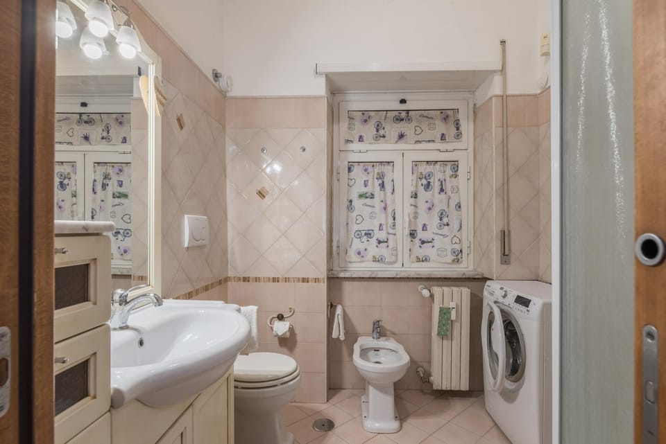 Shower, Toilet, Bathroom, bidet, towels, washing machine
