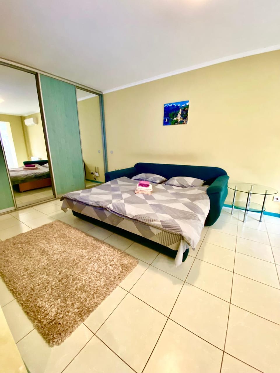 Bed, towels, wardrobe