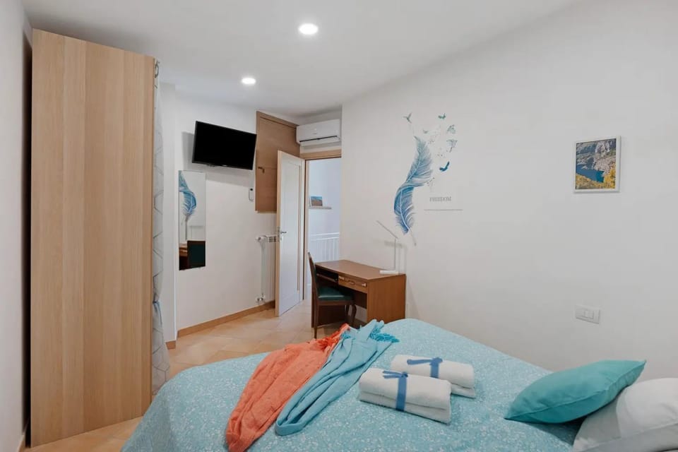 Bedroom, towels, wardrobe, air conditioner