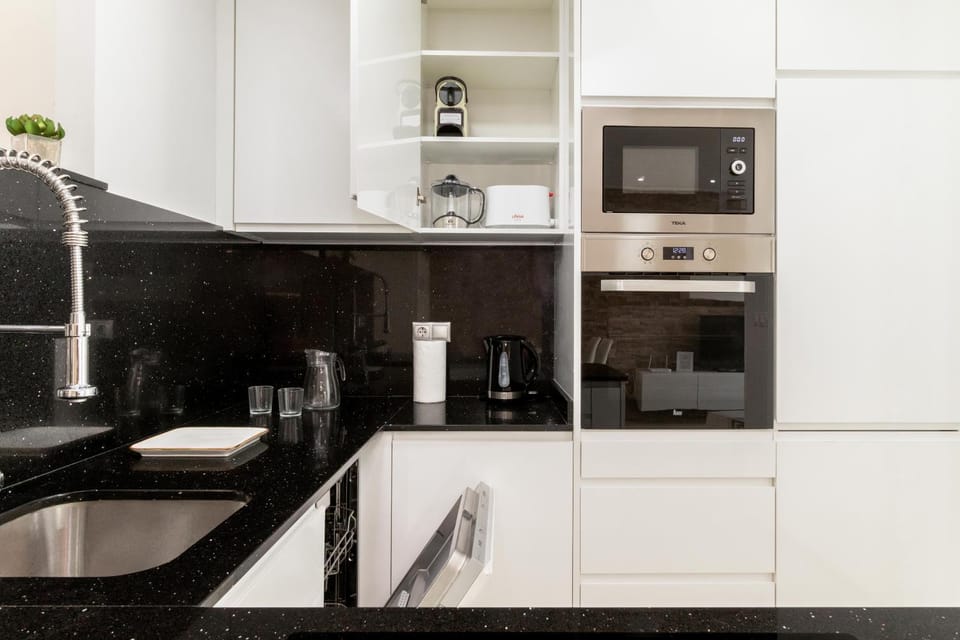 Kitchen or kitchenette, dishwasher, oven, stove, toaster