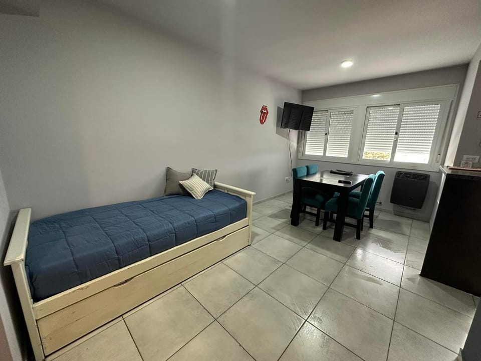 Bed, TV and multimedia, Living room, Seating area, Bedroom