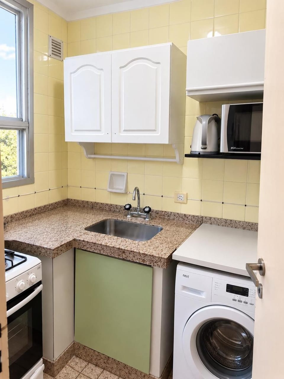 Kitchen or kitchenette, washing machine