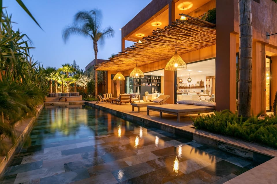 Property building, Patio, Night, Swimming pool, sunbed