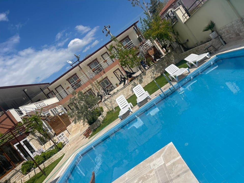 Property building, Day, Pool view, Swimming pool, sunbed