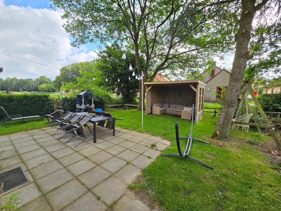7 person House with swing, firepit, hammock, garden, swimming lake, child friendly, in- and outside playground, and great coffee House in Gelderland, Netherlands