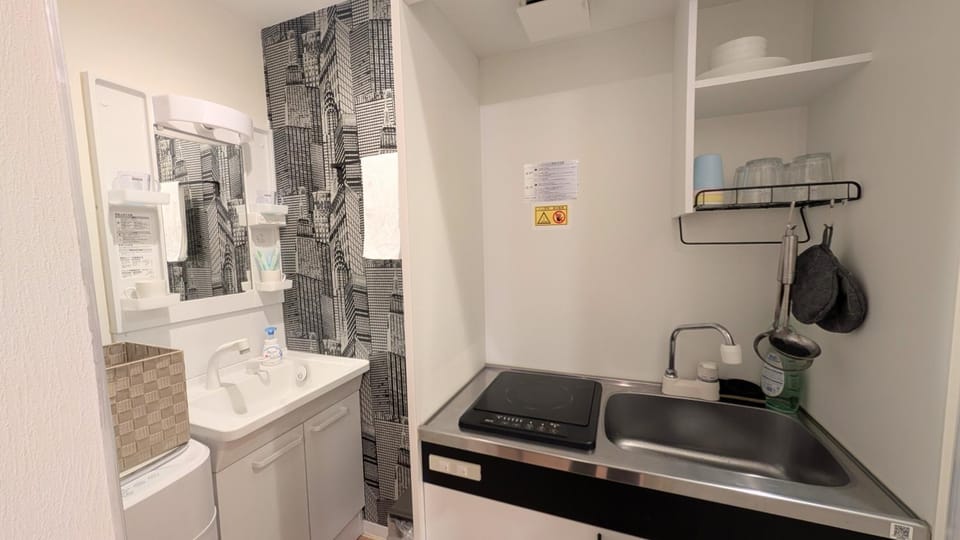 Bathroom, stove, towels, washing machine, kitchen