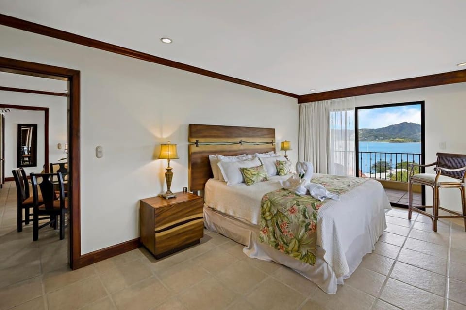 Remodeled Top-Floor Condo with Stunning Wrap-Around Balcony Offering Mountain, Ocean & Marina Views House in Playa Flamingo