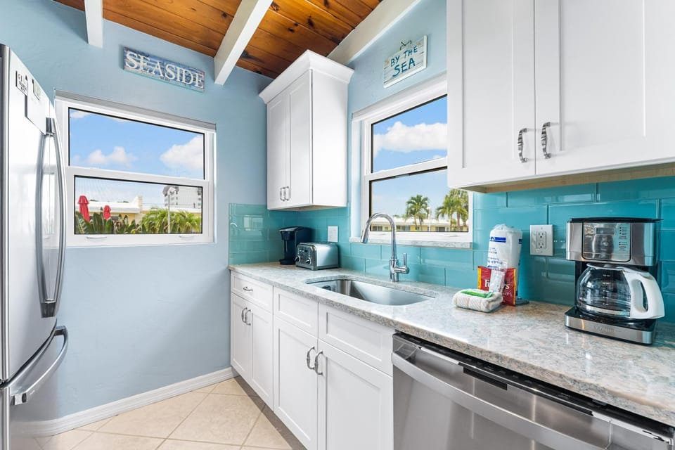 Kitchen or kitchenette, dishwasher, oven, stove