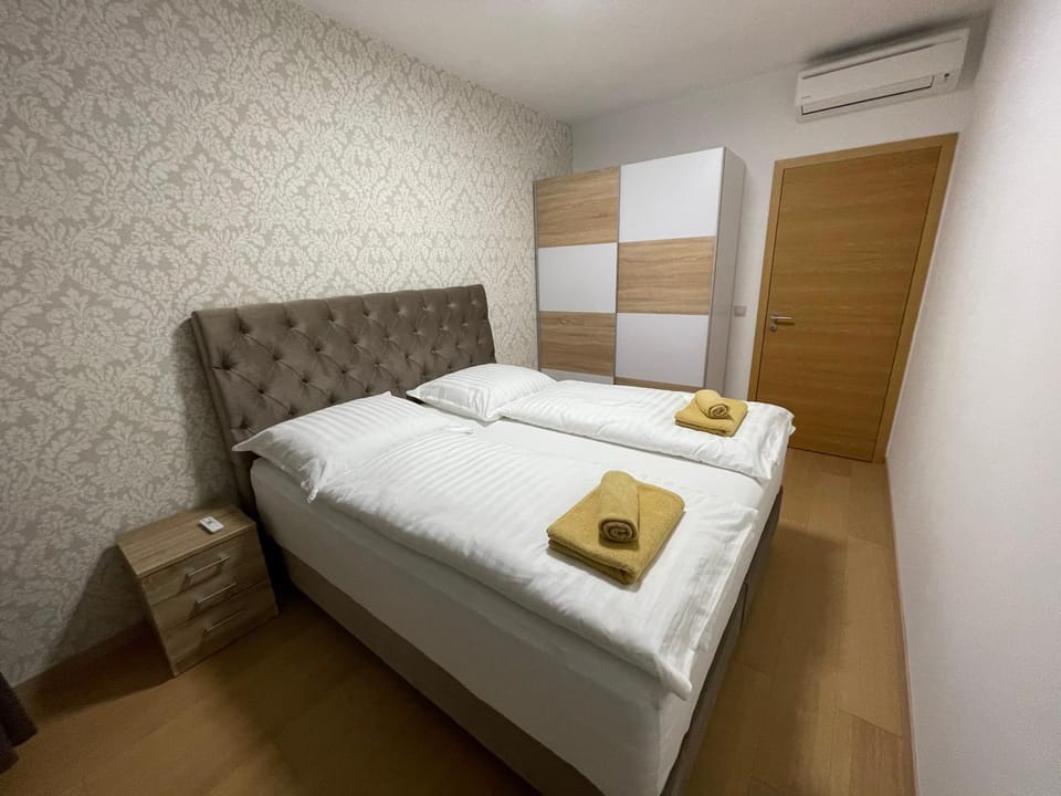 Bed, Bedroom, towels, wardrobe, air conditioner