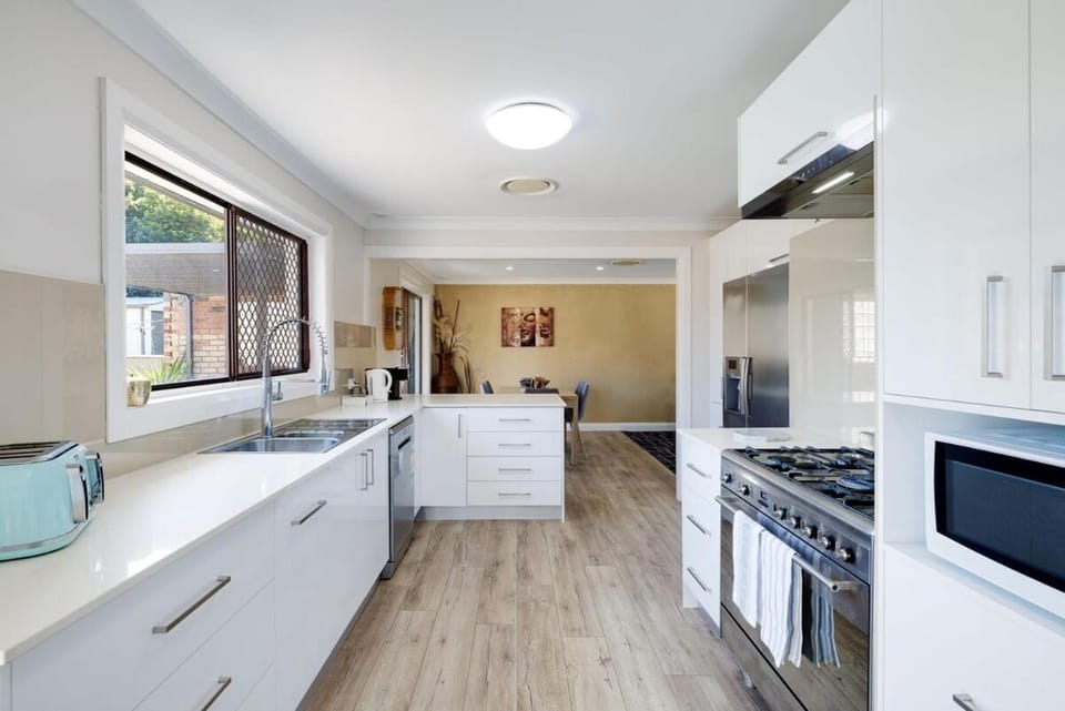 Kitchen or kitchenette, dishwasher, oven, stove