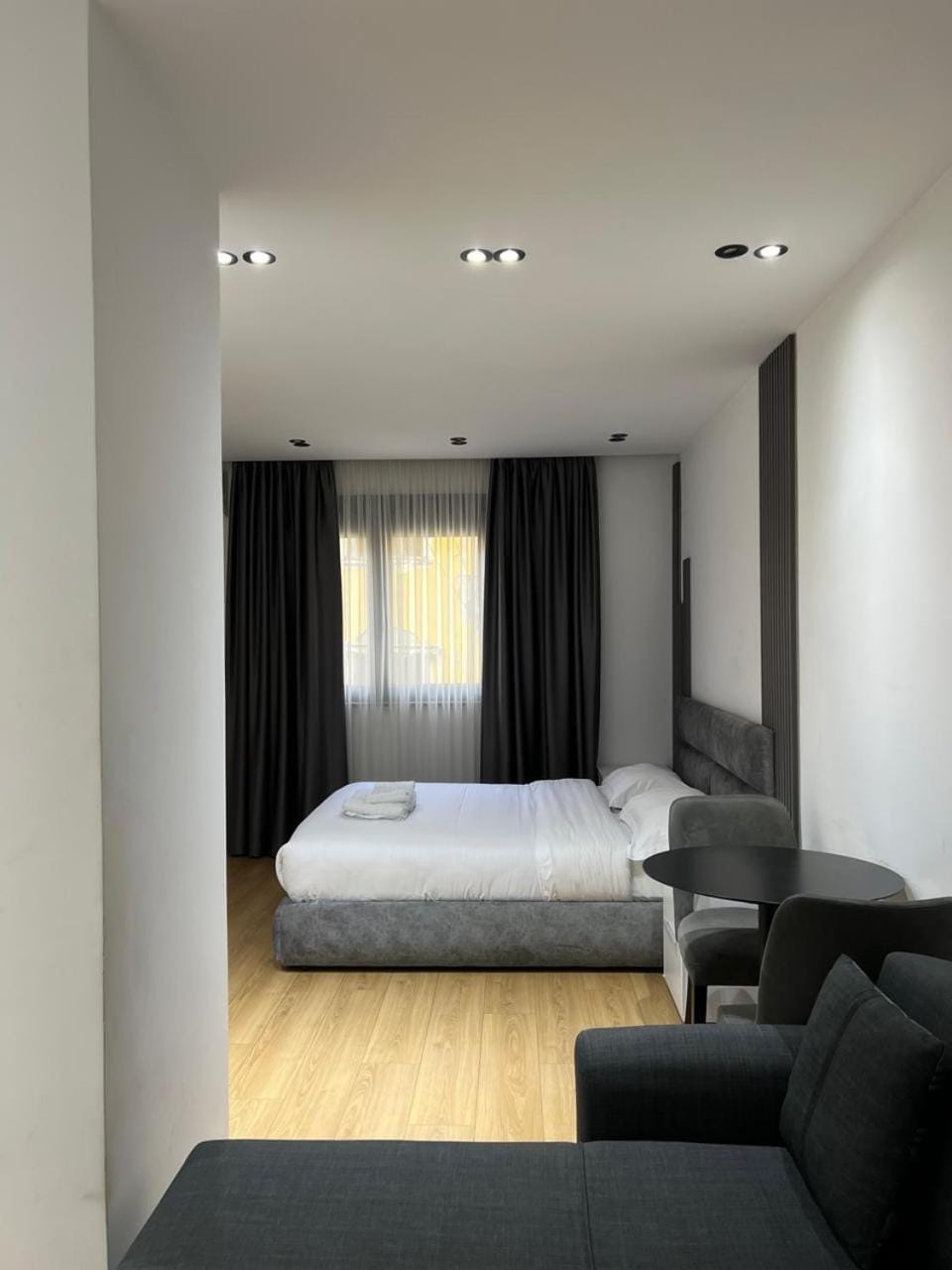 Bed, Living room, Seating area, Bedroom
