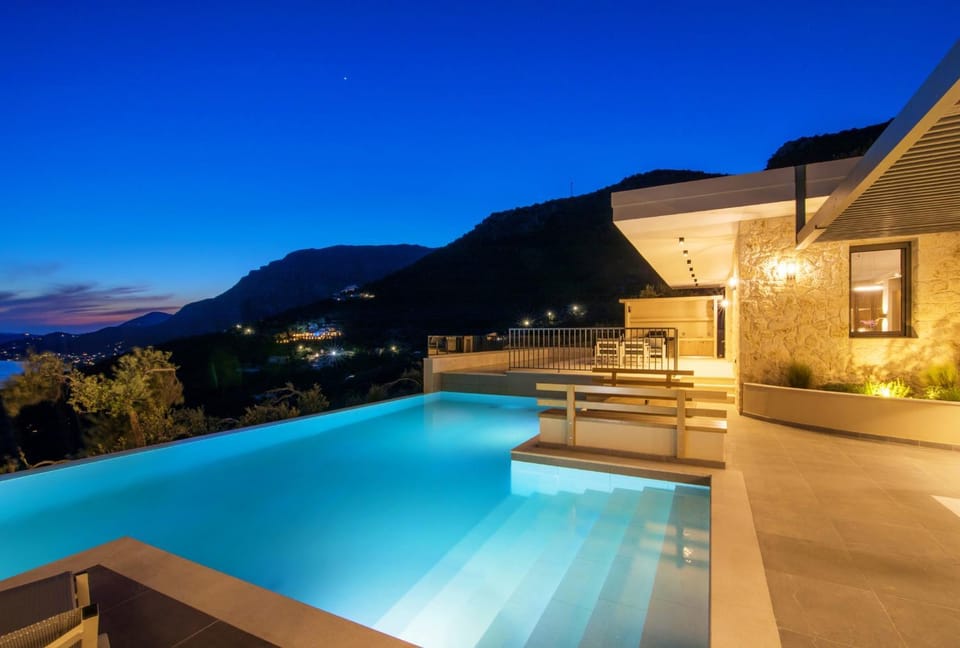 Property building, Patio, Night, Natural landscape, Mountain view, Pool view, Swimming pool, sunbed