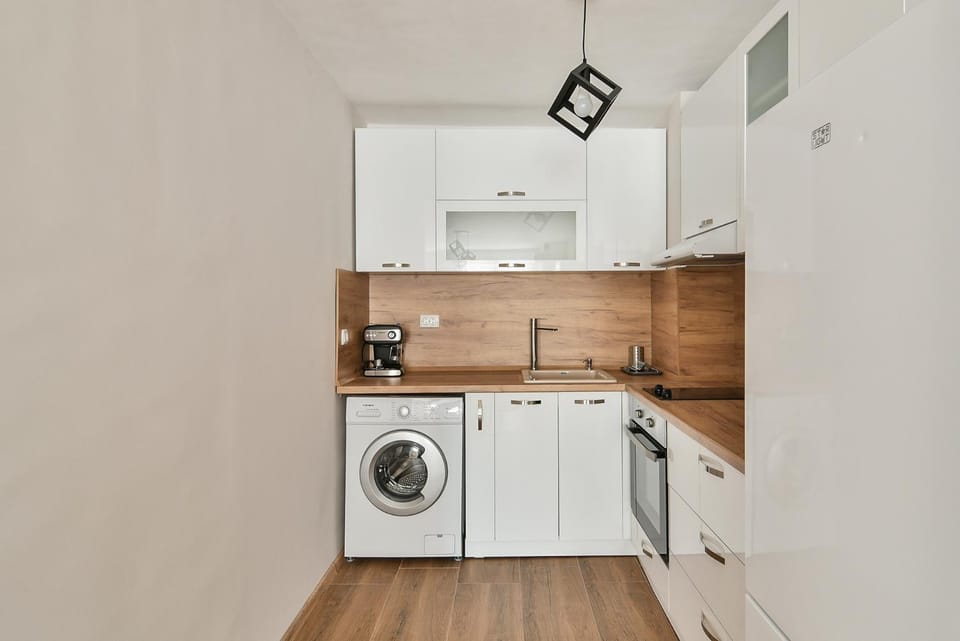 Kitchen or kitchenette, dishwasher, stove, washing machine