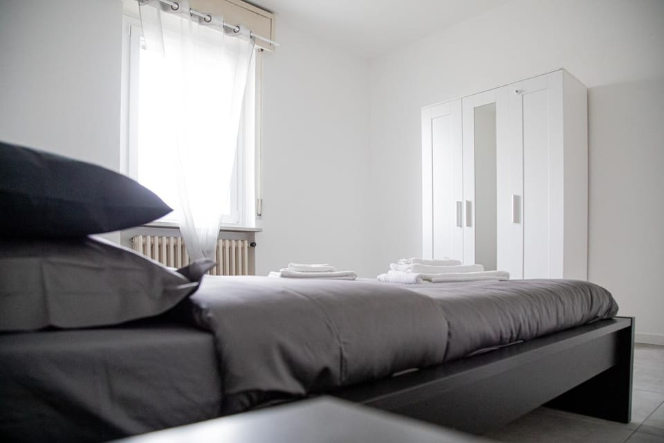 Bed, towels, wardrobe