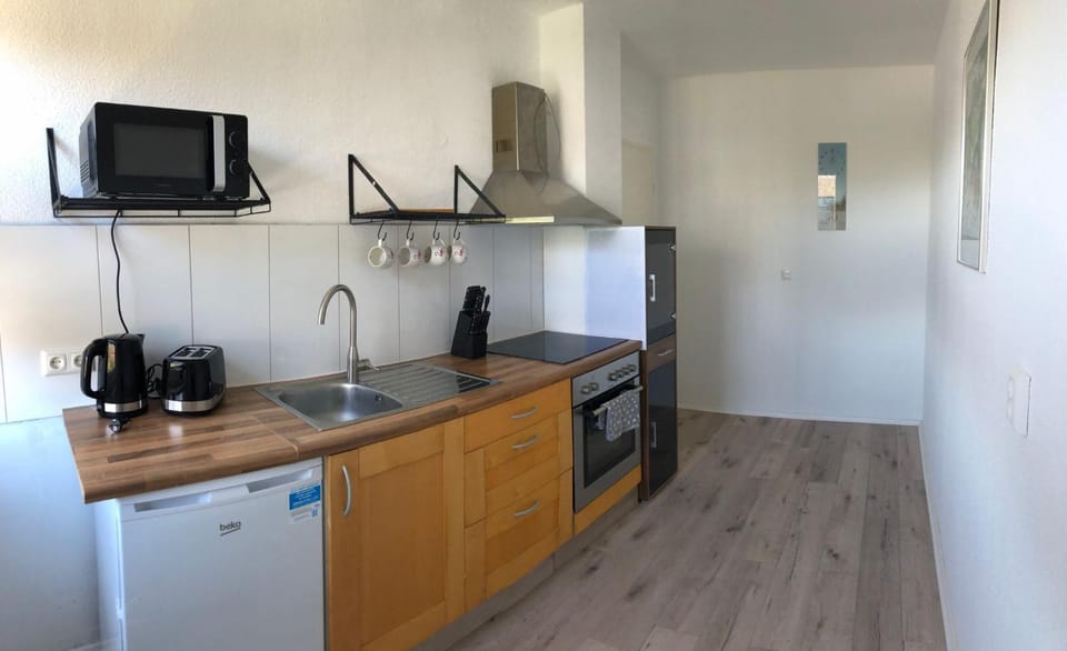 Kitchen or kitchenette, oven, stove, toaster