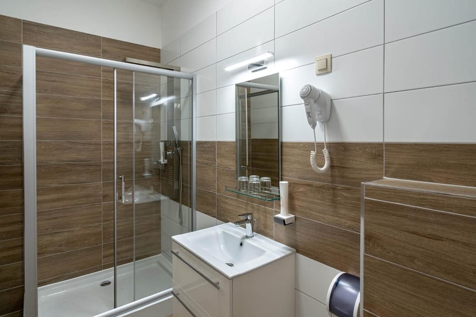 Shower, Toilet, Bathroom, hair dryier, towels